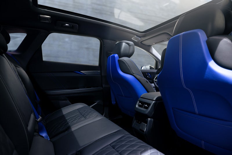 Back Seat View of the 2026 OPTIQ-V Blue Front Seats, Sun Roof, and Interior | Romain Cadillac in Evansville IN